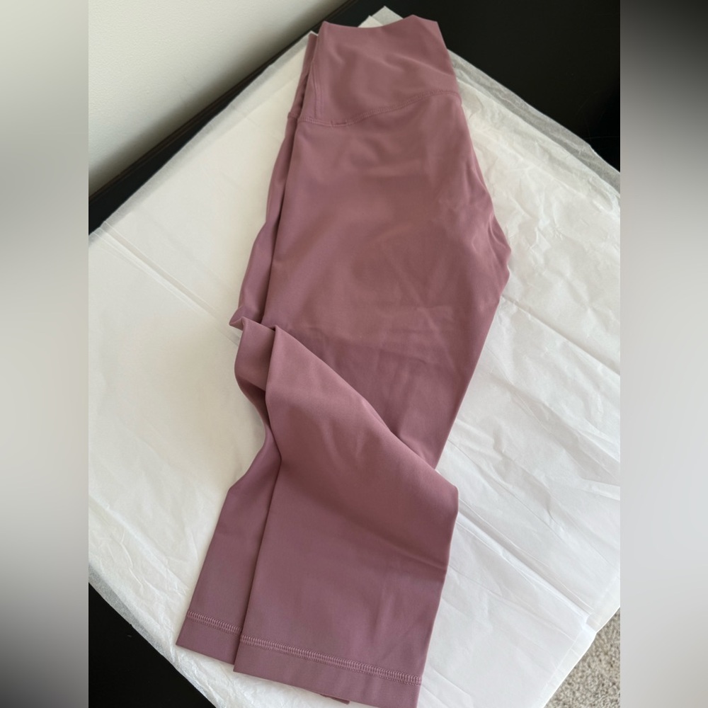 Lululemon Wunder under high rise crop 17”. Size 4. Dusty pink color. Good c.